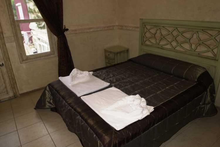 Postel nebo postele na pokoji v ubytování KEMER STAR HOTEL