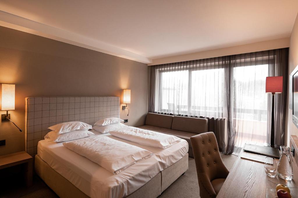 Postel nebo postele na pokoji v ubytování Hotel Pollinger