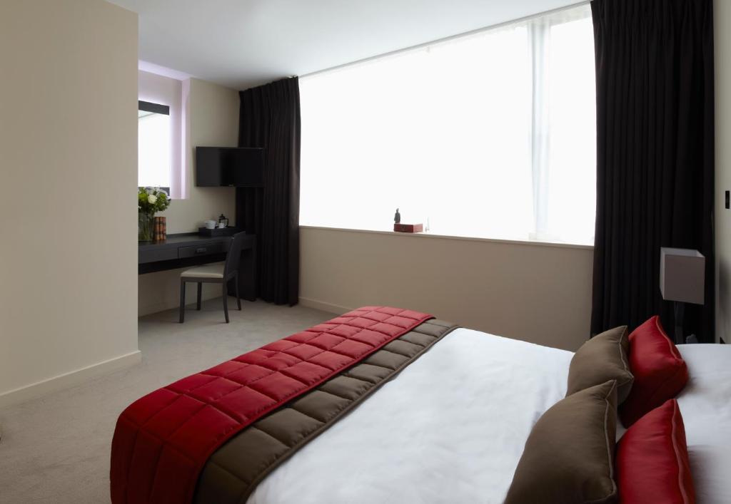 Postel nebo postele na pokoji v ubytování Hotel Xanadu