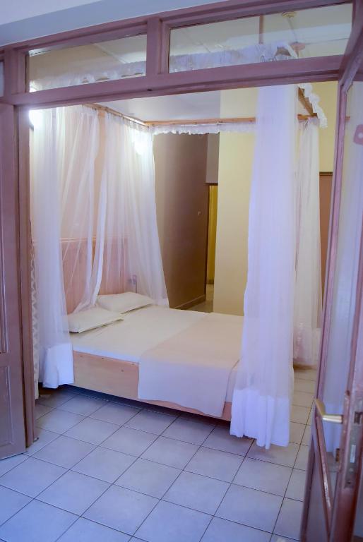 Postel nebo postele na pokoji v ubytování Botanika Hotel