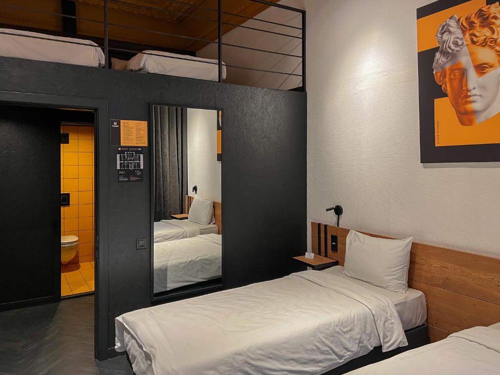 Postel nebo postele na pokoji v ubytování Globe Runner Hotel & Hostel
