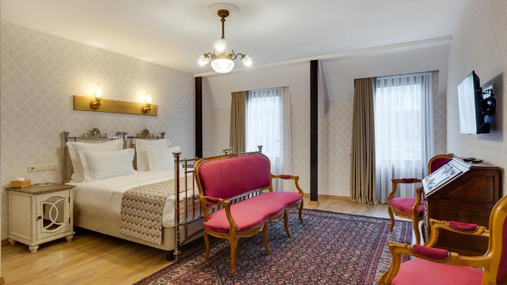 Postel nebo postele na pokoji v ubytování Mukhrantubani Boutique Hotel