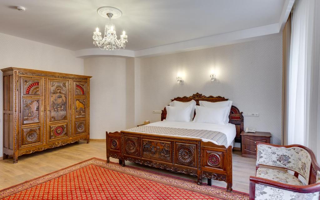 Postel nebo postele na pokoji v ubytování Mukhrantubani Boutique Hotel
