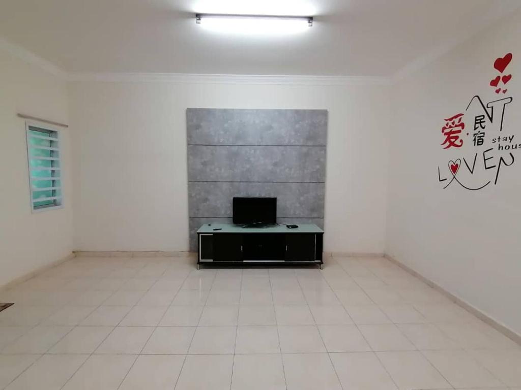 TV a/nebo společenská místnost v ubytování 爱民宿 Love House