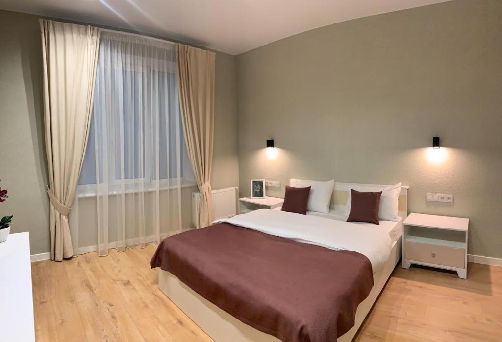 Ένα ή περισσότερα κρεβάτια σε δωμάτιο στο Apart City Home