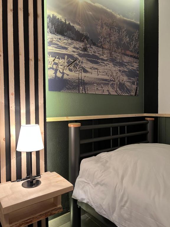 Postel nebo postele na pokoji v ubytování Gite Du Moulin Coquelicot