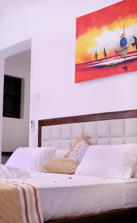 Postel nebo postele na pokoji v ubytování Triple Edge Villa
