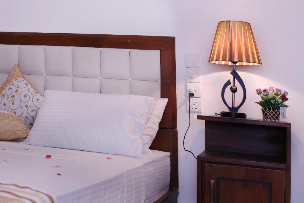 Postel nebo postele na pokoji v ubytování Triple Edge Villa