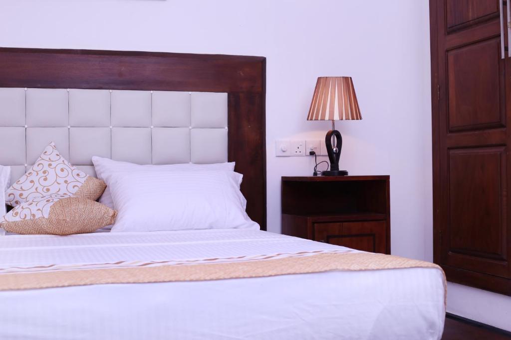 Postel nebo postele na pokoji v ubytování Triple Edge Villa