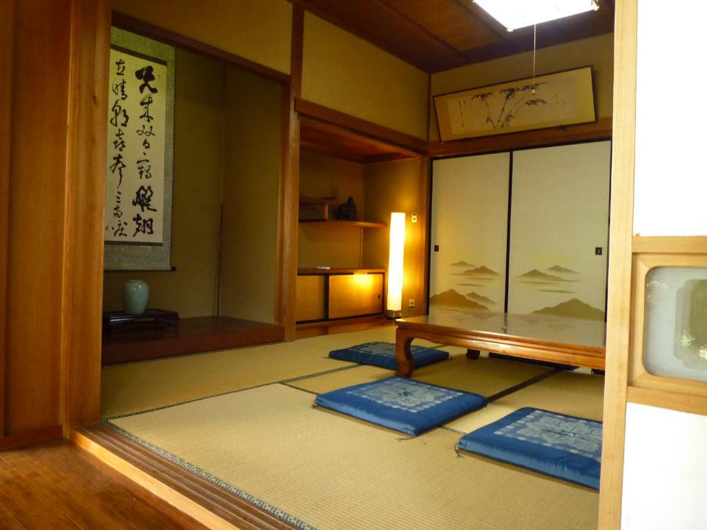 Postel nebo postele na pokoji v ubytování ゲストハウス あずも GuestHouse AZMO