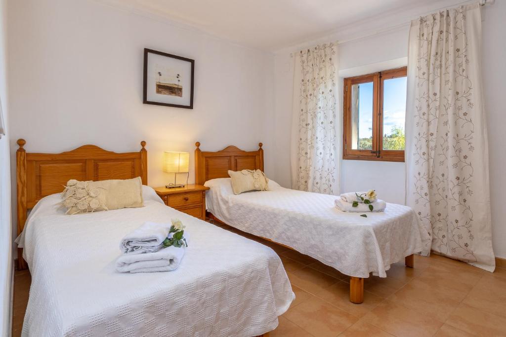 Posteľ alebo postele v izbe v ubytovaní Villa Lloquet By homevillas360