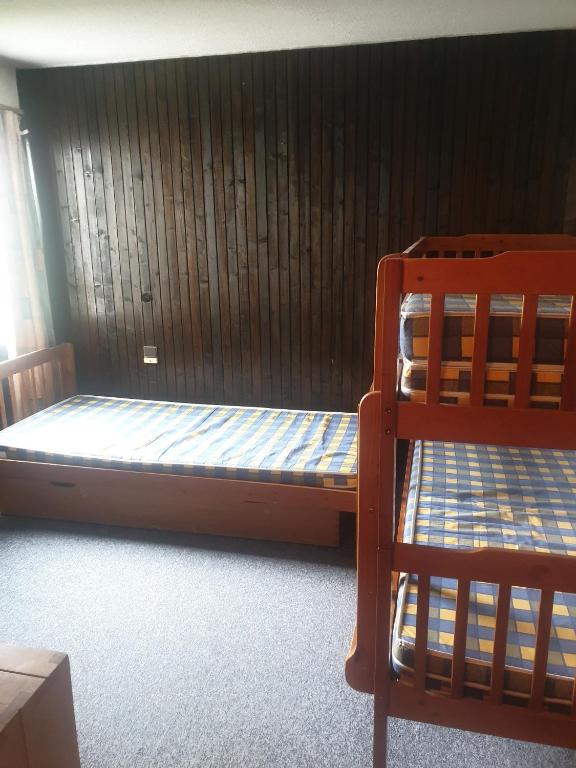 Postel nebo postele na pokoji v ubytování Olympic Appartements VTI