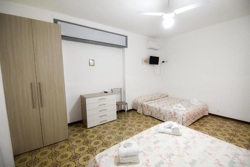 Кровать или кровати в номере Sea Salento Casa Vacanze