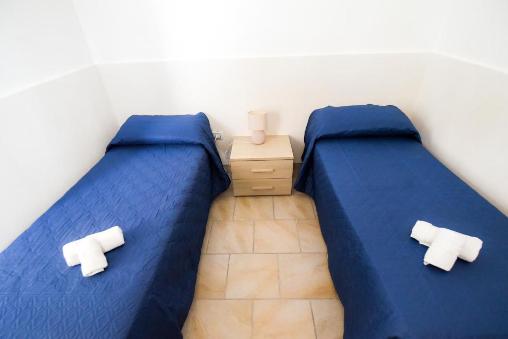 Кровать или кровати в номере Sea Salento Casa Vacanze