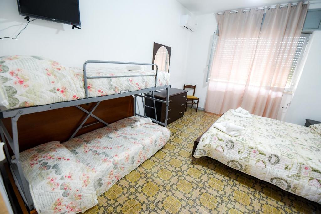 Кровать или кровати в номере Sea Salento Casa Vacanze