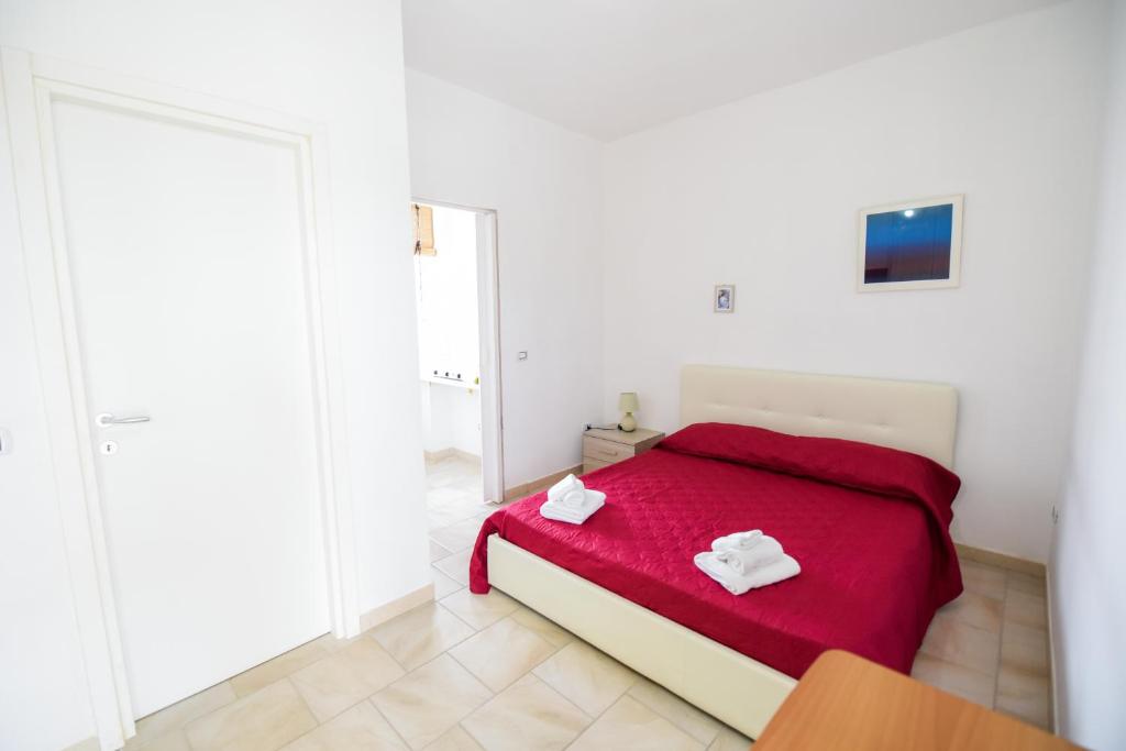 Кровать или кровати в номере Sea Salento Casa Vacanze