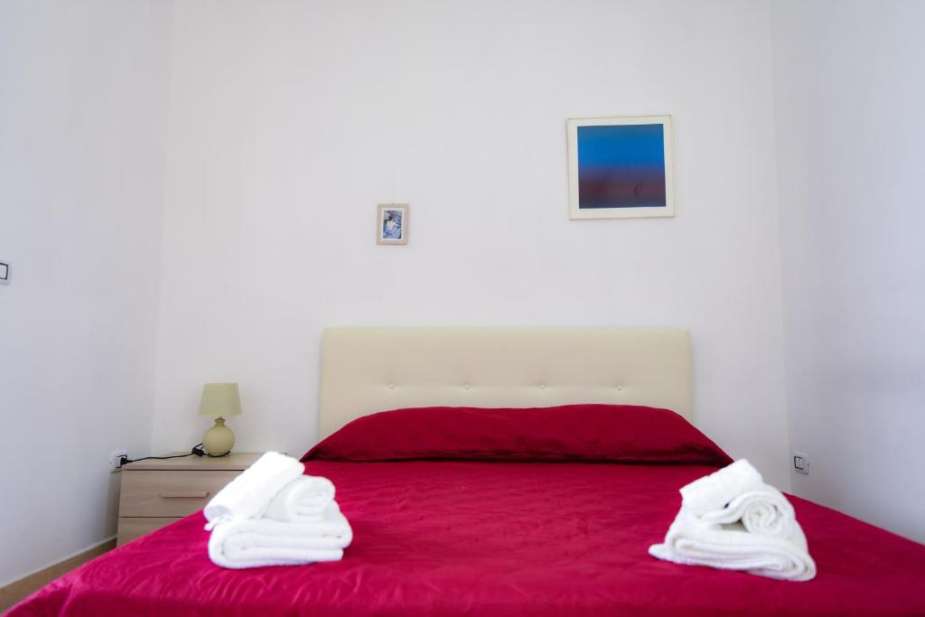 Кровать или кровати в номере Sea Salento Casa Vacanze