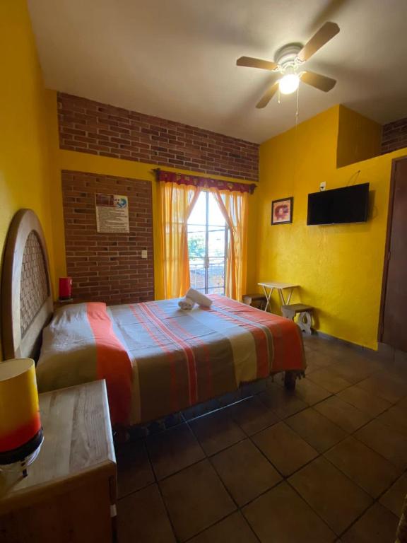 Postel nebo postele na pokoji v ubytování Posada la Natividad