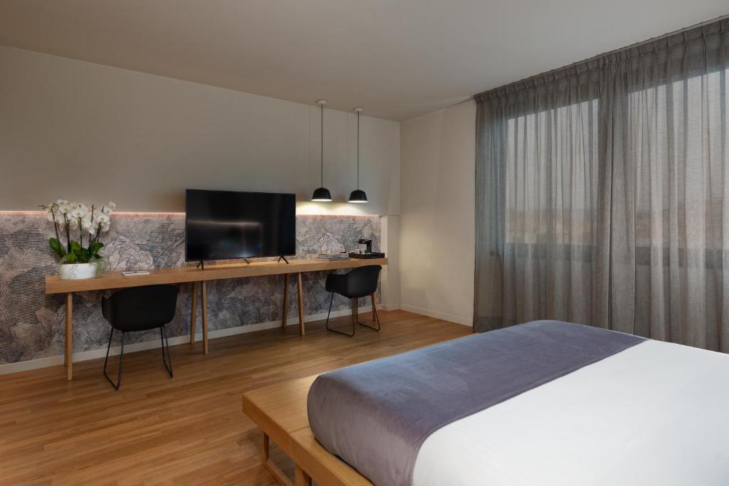 Postel nebo postele na pokoji v ubytování Hotel Leopardi