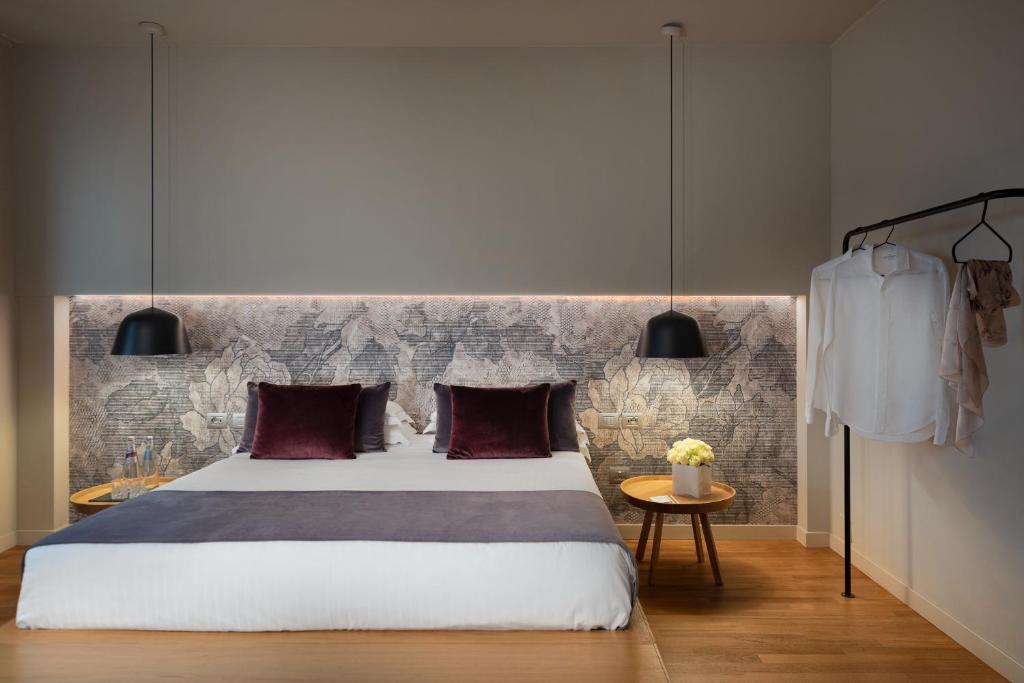 Postel nebo postele na pokoji v ubytování Hotel Leopardi