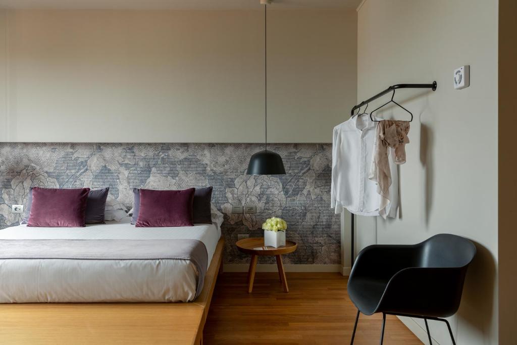 Postel nebo postele na pokoji v ubytování Hotel Leopardi
