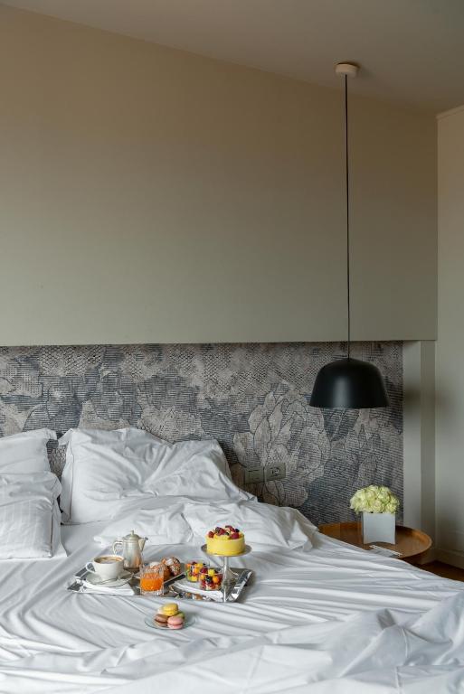 Postel nebo postele na pokoji v ubytování Hotel Leopardi