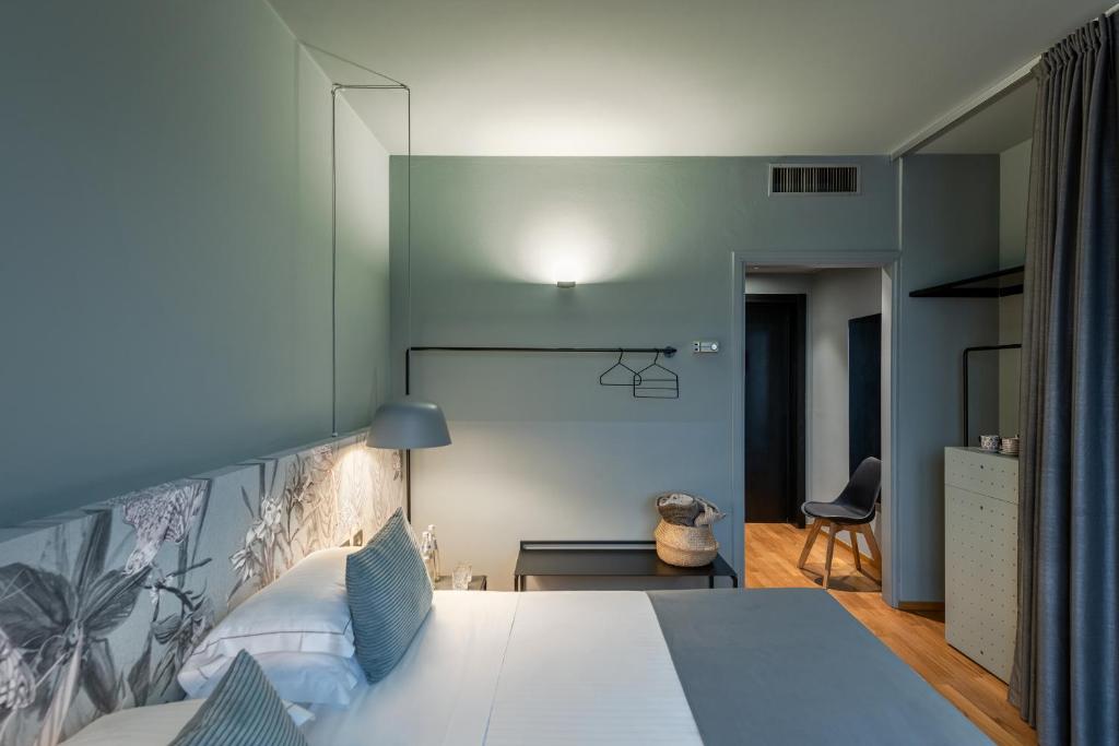 Postel nebo postele na pokoji v ubytování Hotel Leopardi