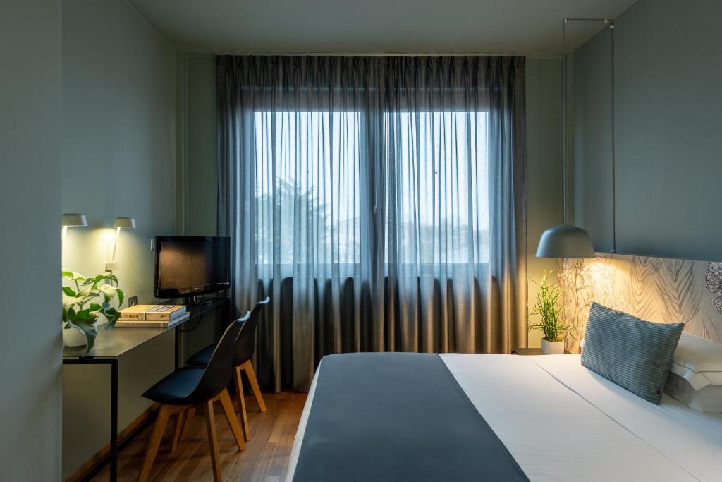 Postel nebo postele na pokoji v ubytování Hotel Leopardi