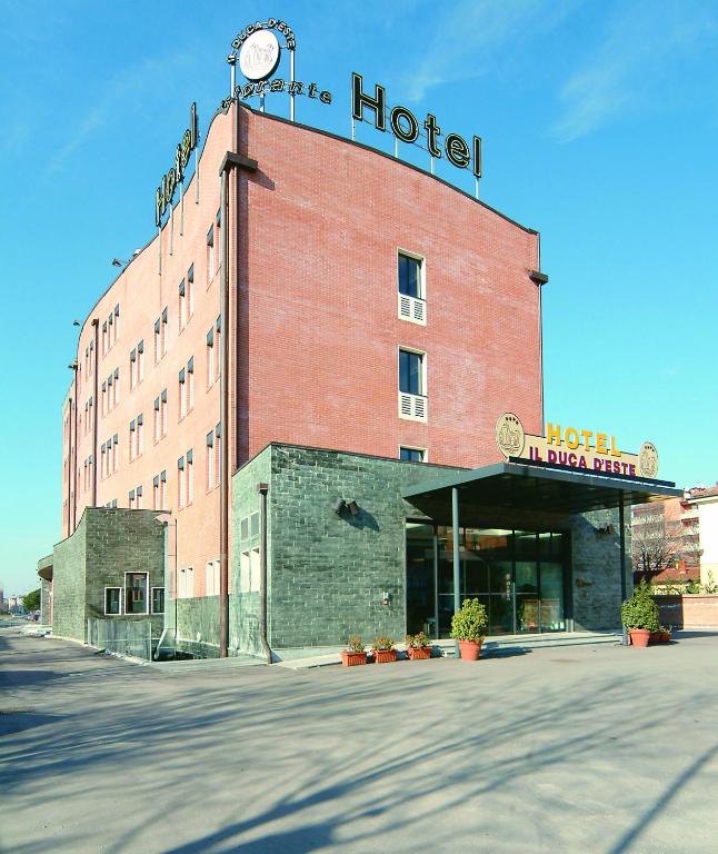 a hotel building with a clock on top of it at Hotel Il Duca d'Este in Ferrara