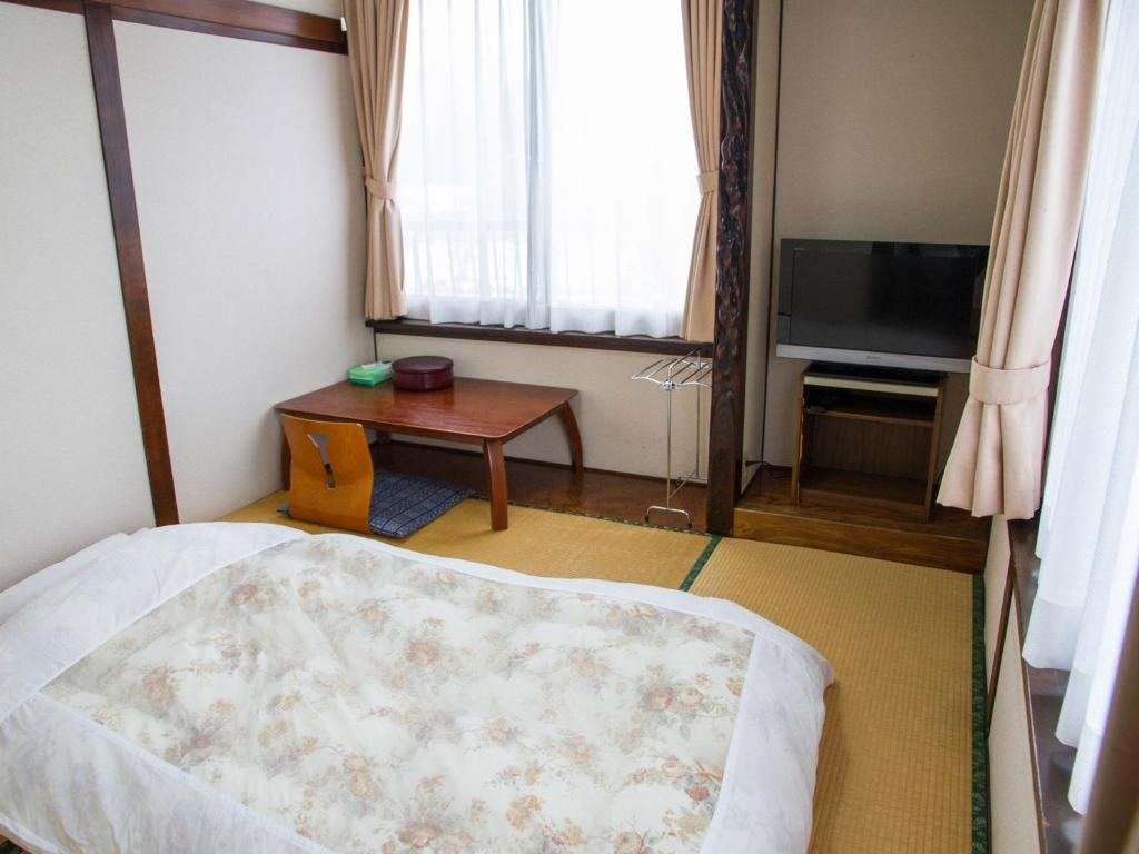 Tempat tidur dalam kamar di Ryokan Seifuso - Vacation STAY 02204v