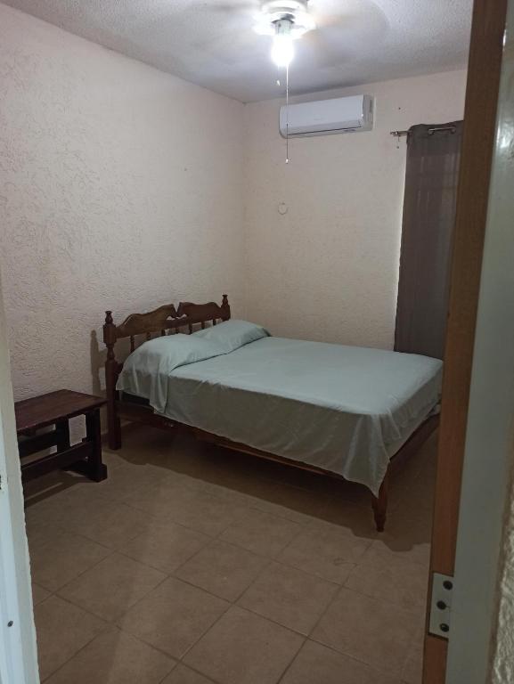 Una cama o camas en una habitación de Casita Mahahual, Grand Costa Maya