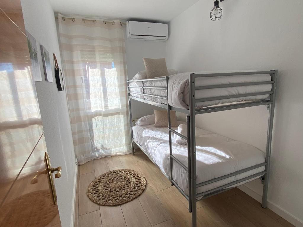 A bed or beds in a room at Vilamarlux VI