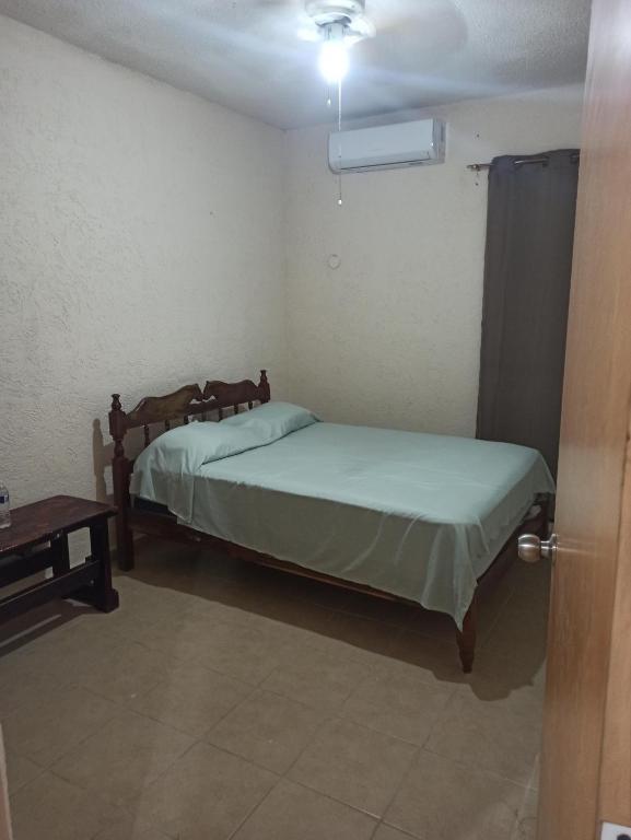 Una cama o camas en una habitación de Casita Mahahual, Grand Costa Maya