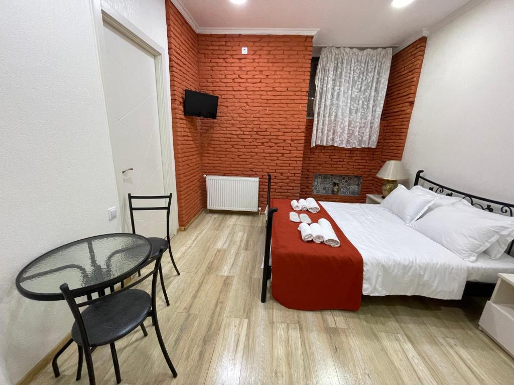 Postel nebo postele na pokoji v ubytování AA Hotel