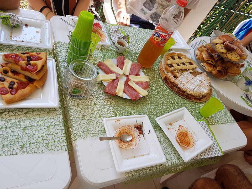 a table with plates of food on top of it at B & B La Magnolia in Specchiolla