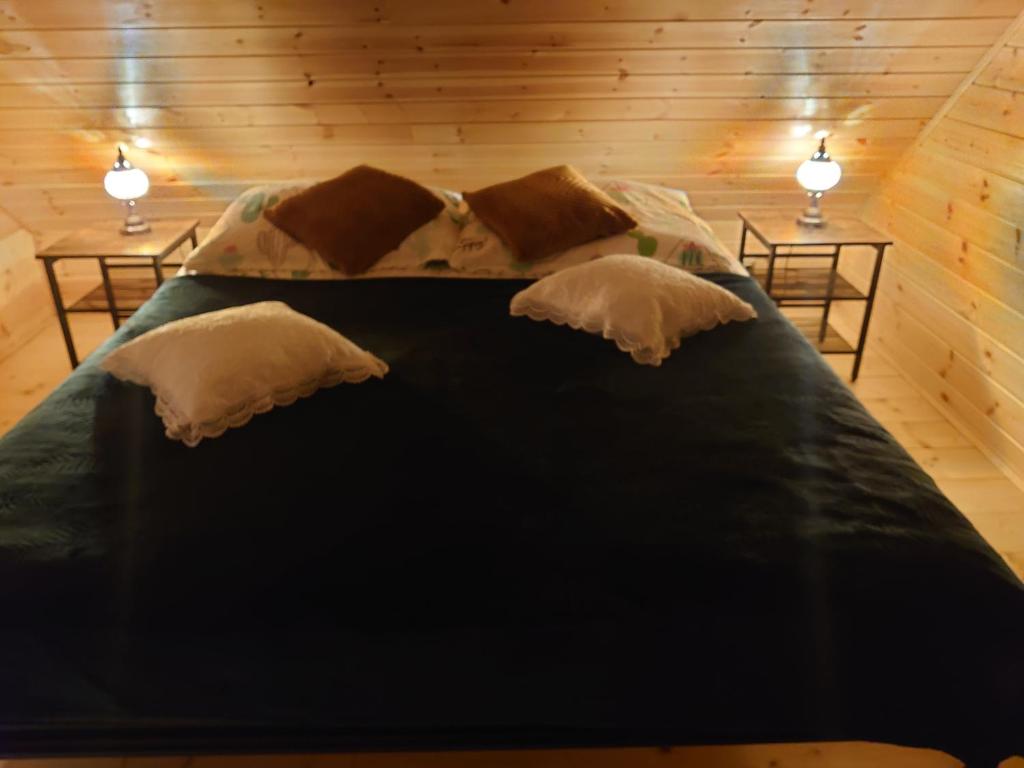 Postel nebo postele na pokoji v ubytování DOMKI KOLOROWE