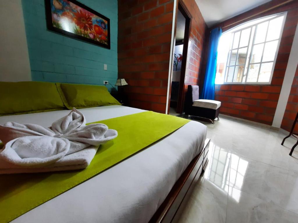 Postel nebo postele na pokoji v ubytování Hostal Balcon del Cielo