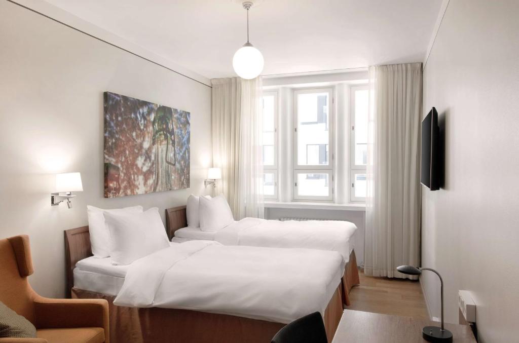 Postel nebo postele na pokoji v ubytování Radisson Blu Aleksanteri Hotel, Helsinki