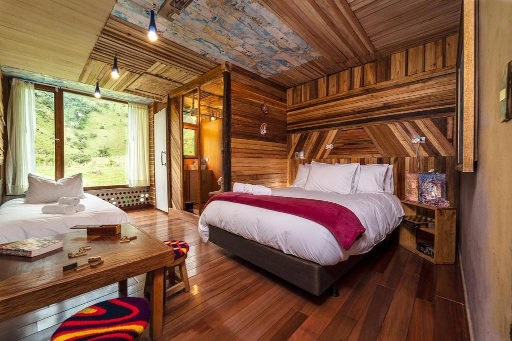 Postel nebo postele na pokoji v ubytování Mamallacta Páramo Lodge