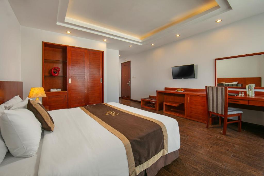 Postel nebo postele na pokoji v ubytování Bounty Hotel