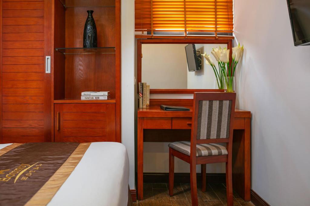Postel nebo postele na pokoji v ubytování Bounty Hotel