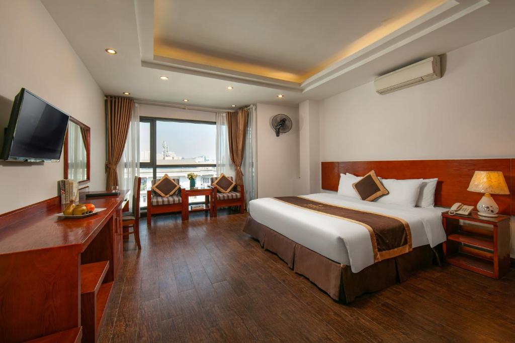 Postel nebo postele na pokoji v ubytování Bounty Hotel