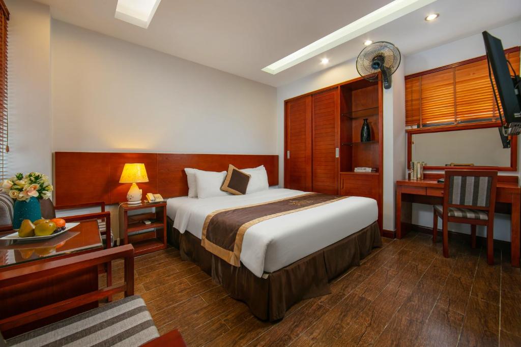 Postel nebo postele na pokoji v ubytování Bounty Hotel