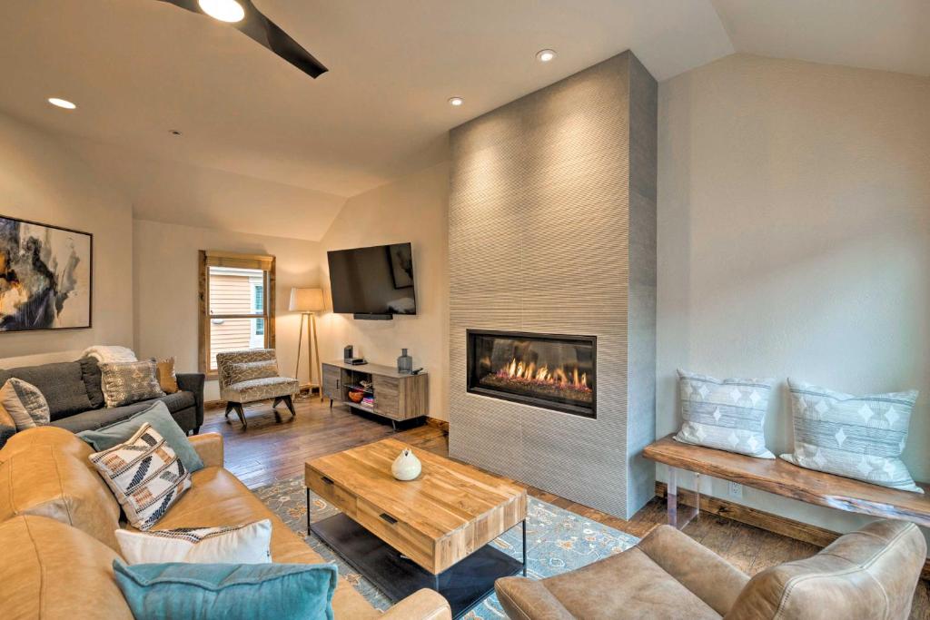 a living room with a couch and a fireplace at Park City Condo, Walk to Park City Mtn Lifts! in Park City