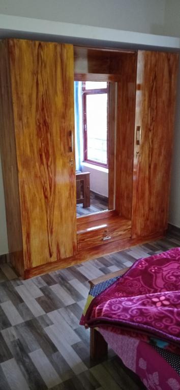 Postel nebo postele na pokoji v ubytování Coorg West End Home Stay