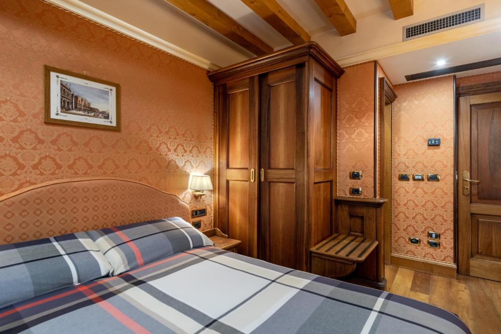 Postel nebo postele na pokoji v ubytování Hotel Montecarlo
