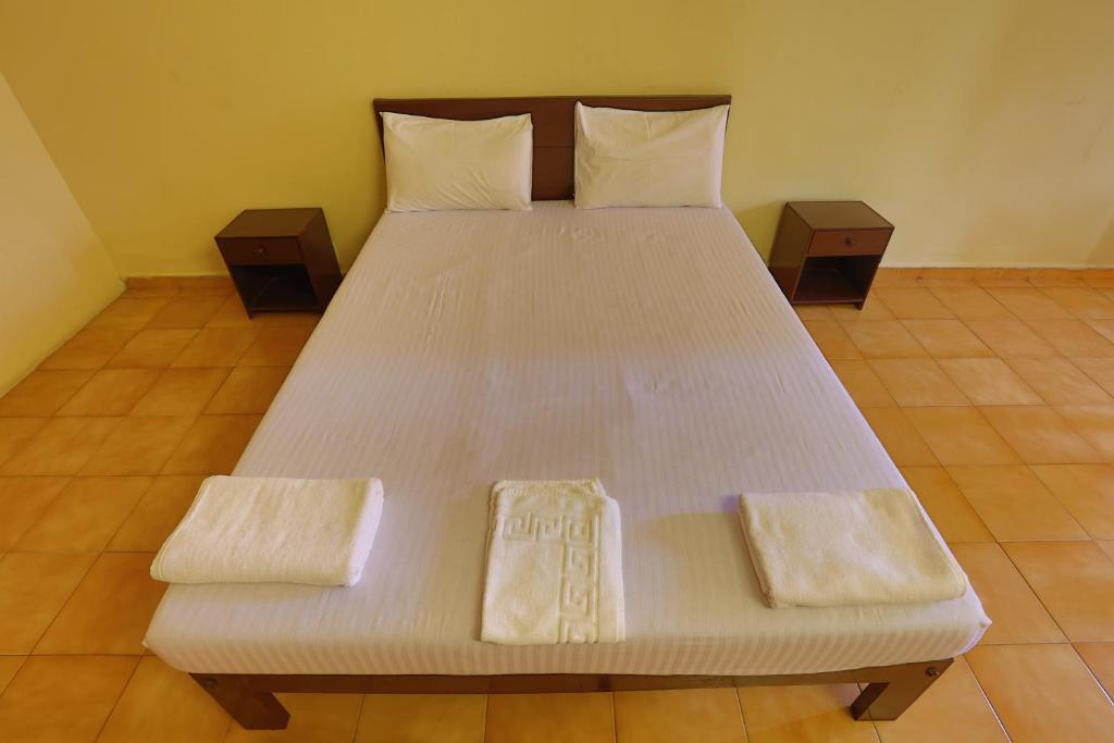 Uma cama ou camas num quarto em Hotel Orfil