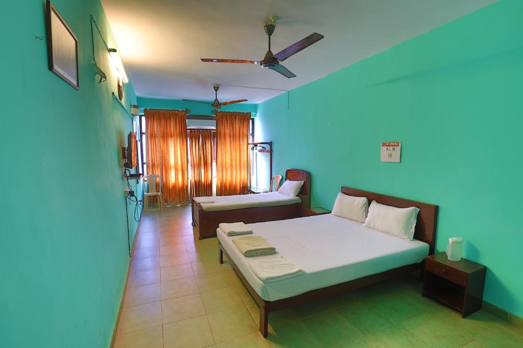 Uma cama ou camas num quarto em Hotel Orfil