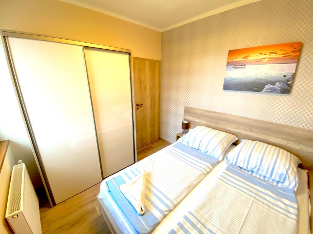 Postel nebo postele na pokoji v ubytování Unio Vendégház 2
