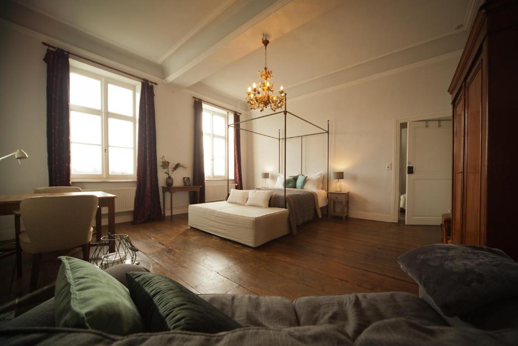 Postel nebo postele na pokoji v ubytování B&B De Kersentuin